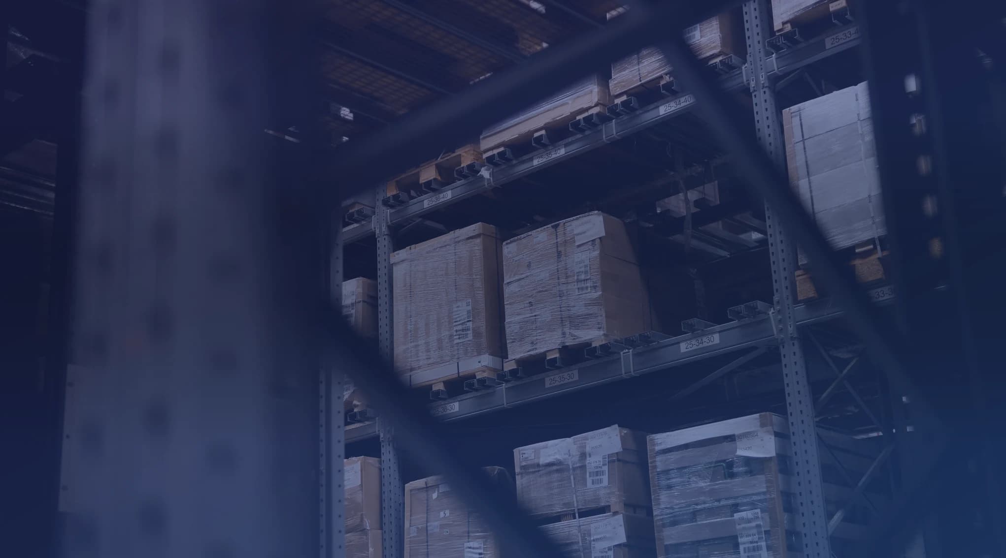 Pallet racking stacked with boxed household goods inside a long-term storage warehouse