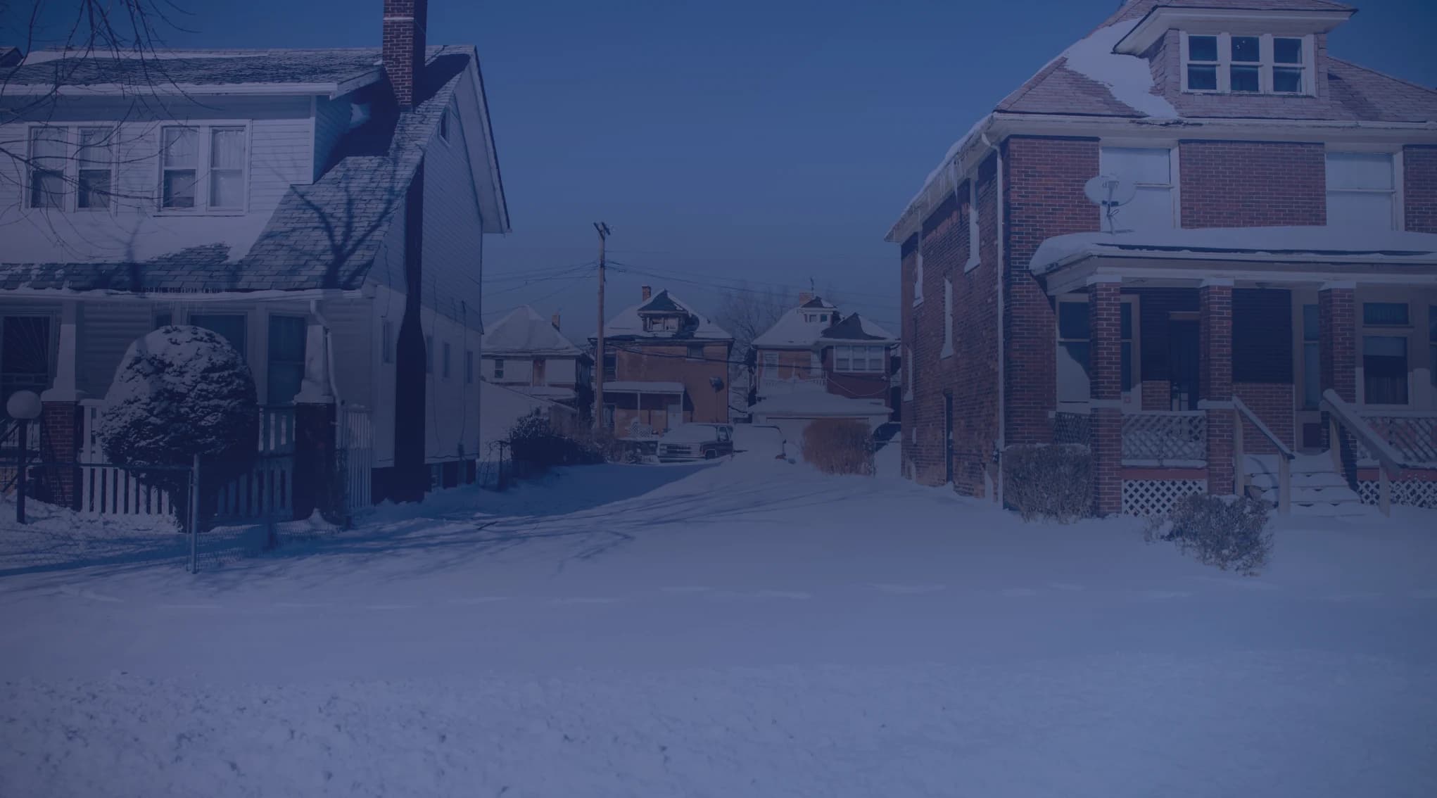 A moving truck on a snowy street representing a winter PCS move for a military family